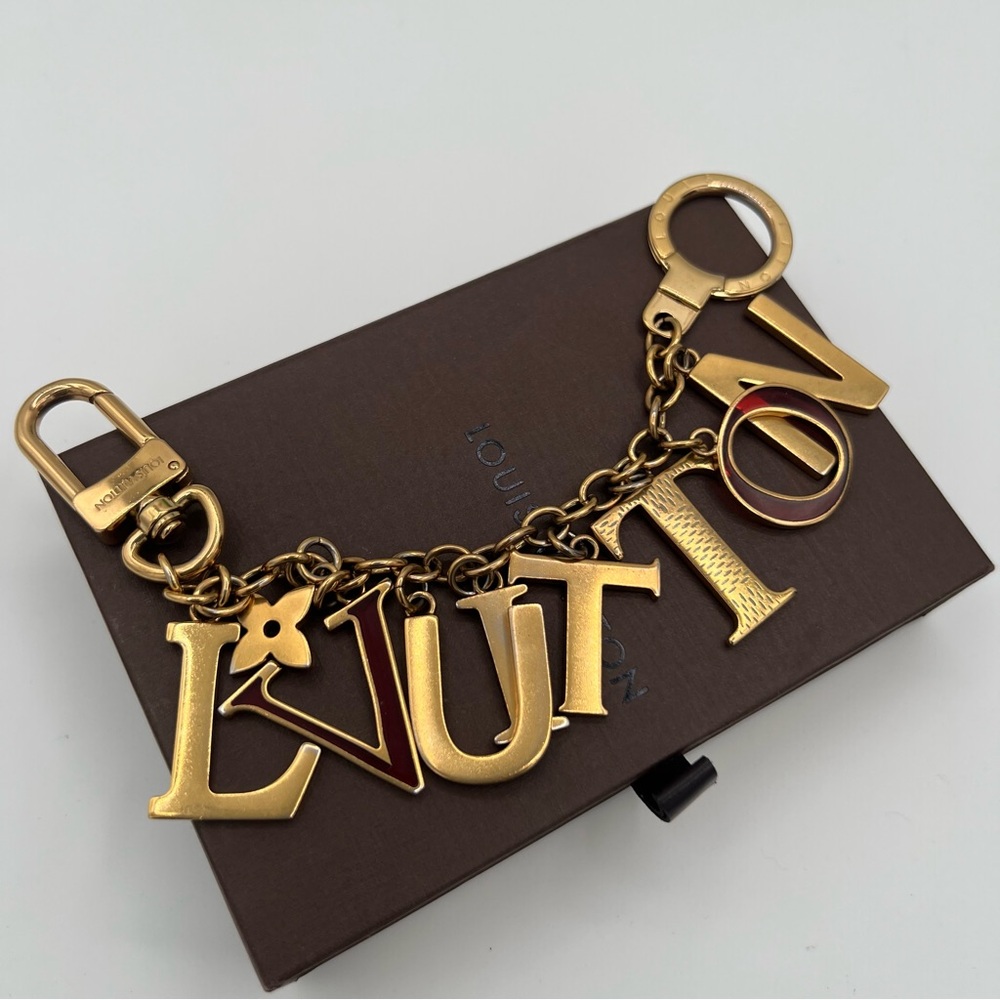 Louis Vuitton Gold large letters key charm in box ❤️Authentic